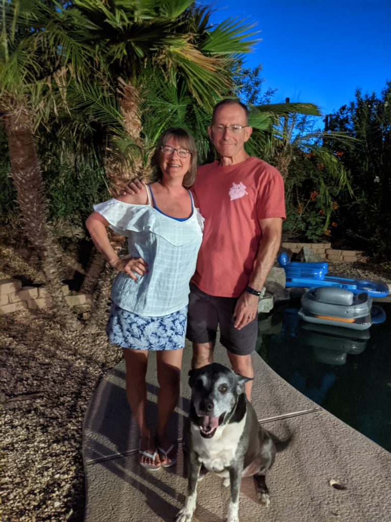 Bill and Sherrie Horton by the pool with their dog, Duff